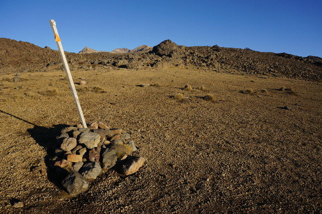 orange pole in desert orange pole in desert